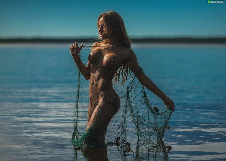 Beautiful naked woman in water