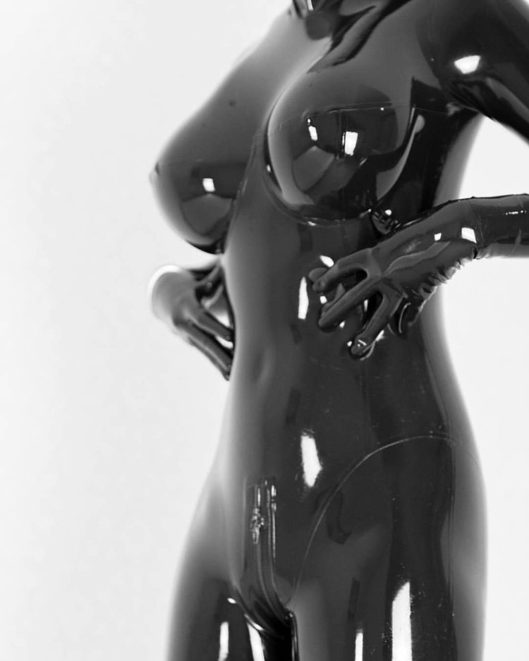 Naked in a latex suit