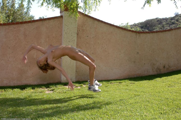 Naked woman makes a somersault