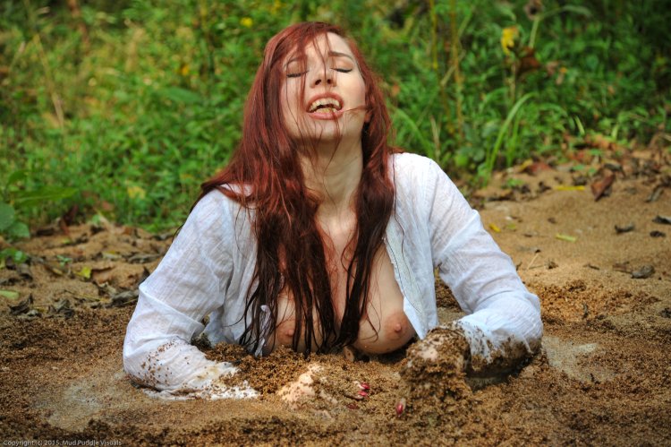 Girl sinking in a quicksand swamp