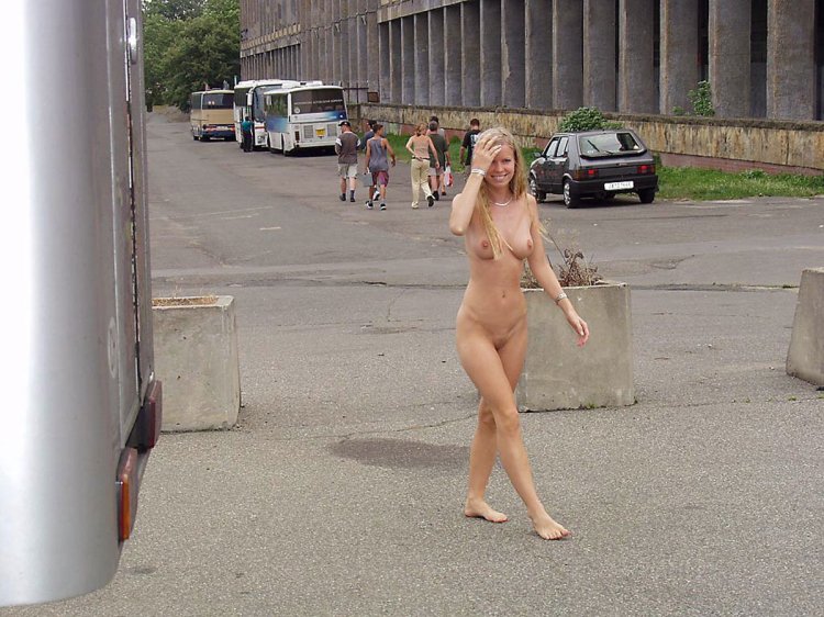 A naked blonde walks