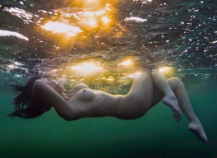 Naked girls in water