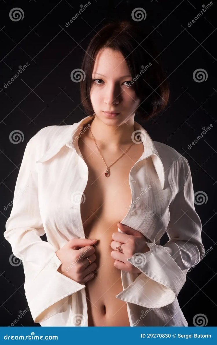 Woman in a shirt on a naked body