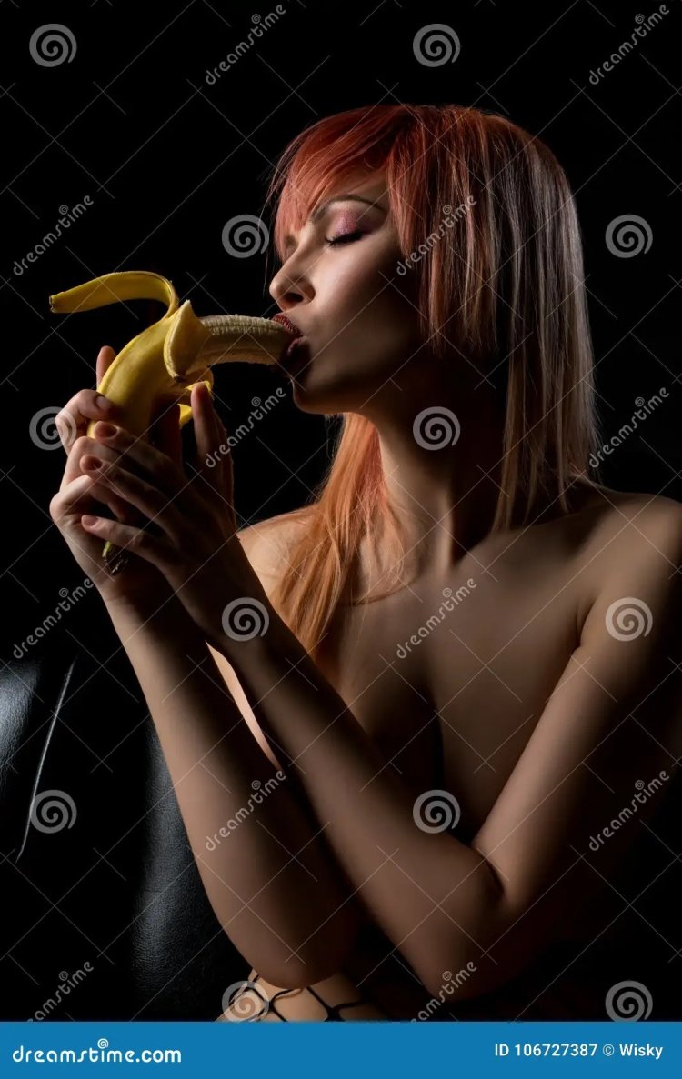 The girl eats a banana