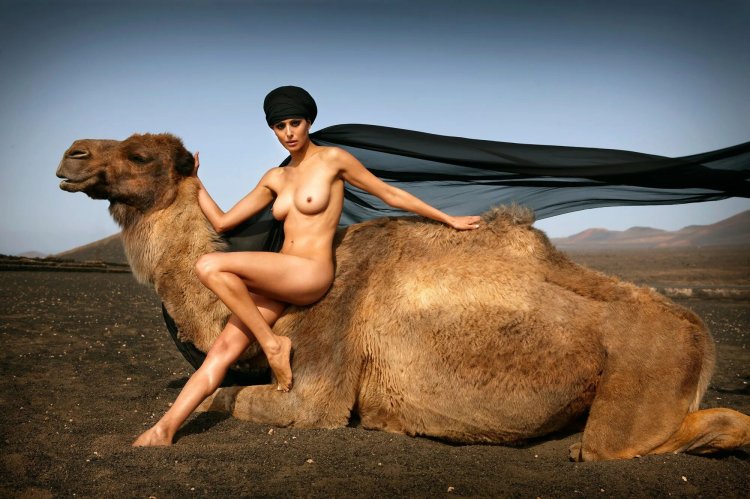 Naked women with animals