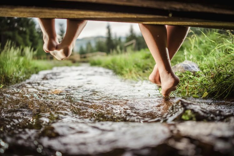 Girl barefoot in the rain