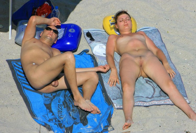 Naked members on the beach