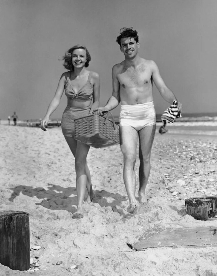 Vacationers on the beach retro