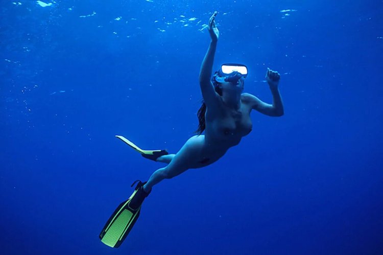 Girl in flippers underwater