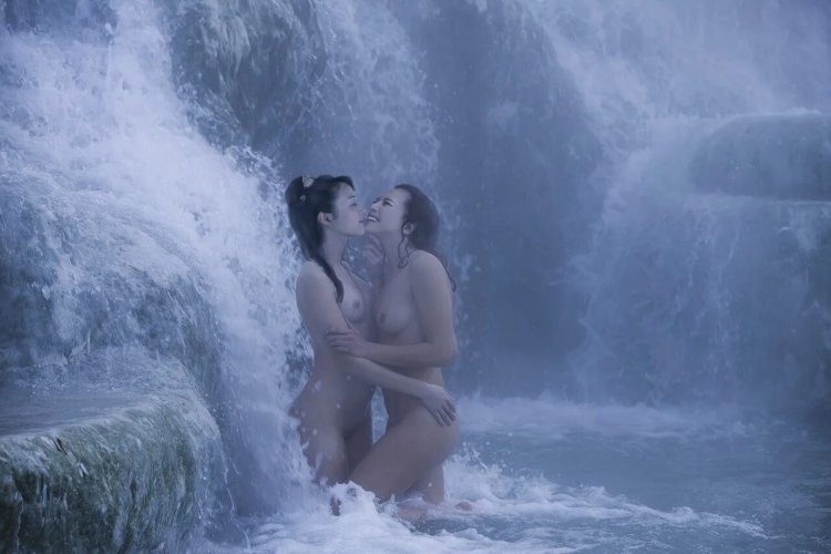 Naked girls at the waterfall